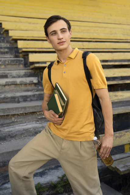 medium-shot-man-holding-books